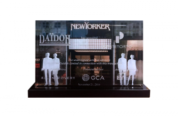 Storefront printed on back of a crystal panel with customer silhouettes 2D etched at right & left