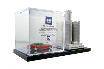 Hot Wheels miniature in a custom plexi box beside a custom pewter model of Detroit's Renaissance Center.